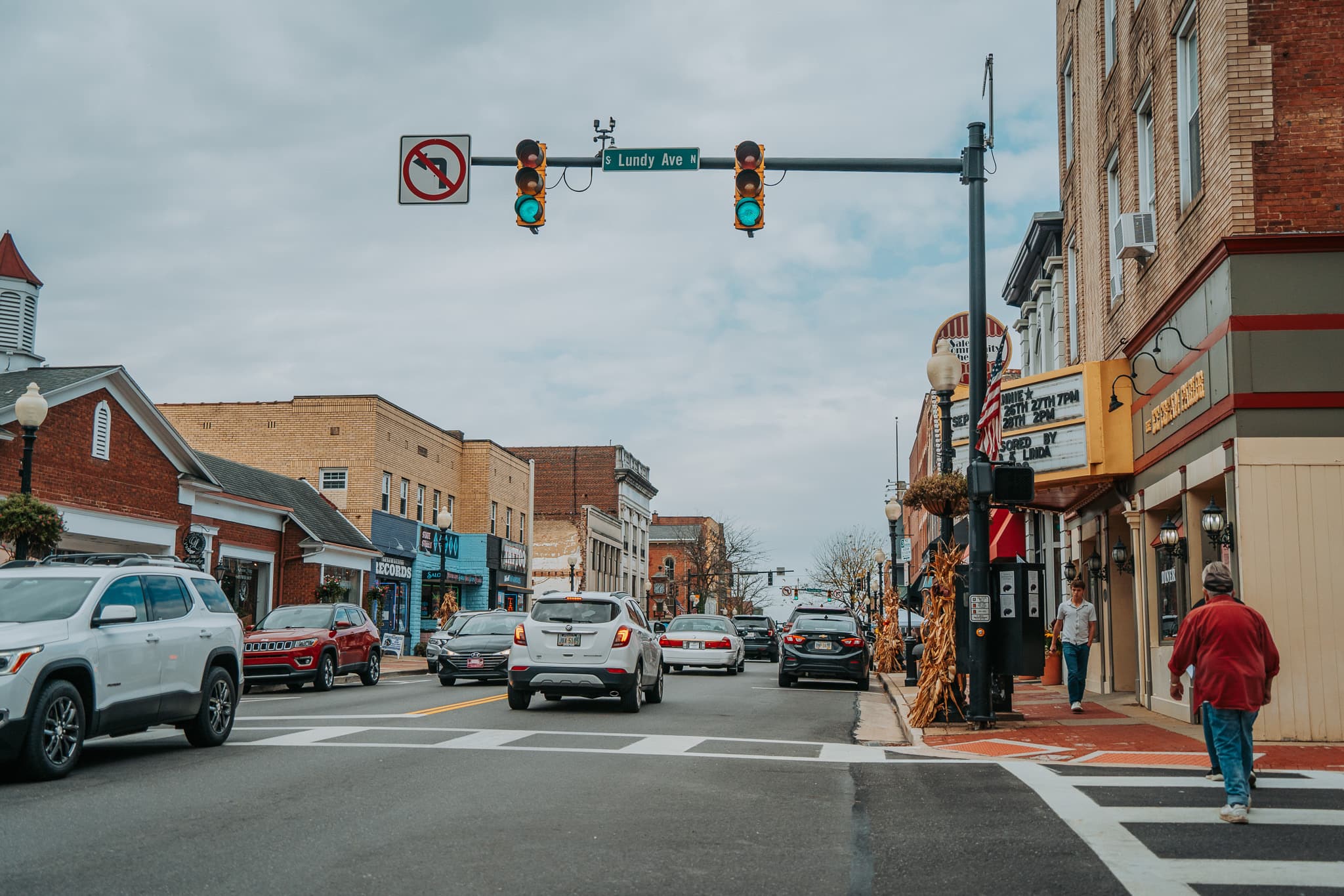 Cars with auto insurance driving through downtown Canfield, OH