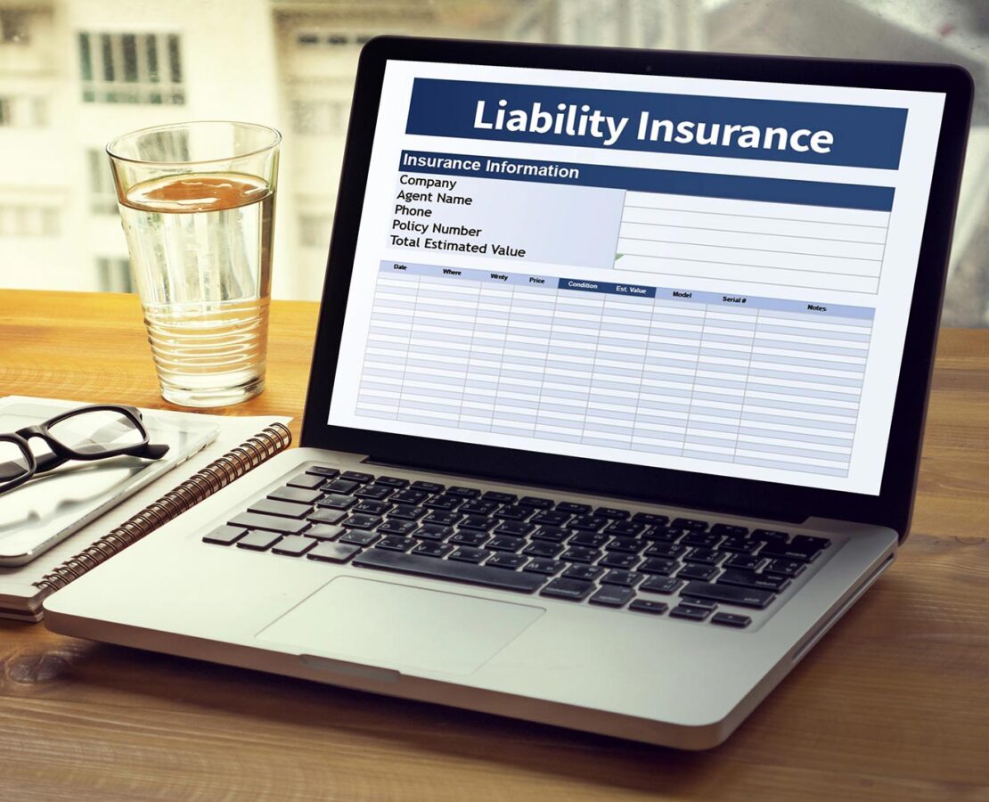 A laptop showing a general liability insurance form in Boardman, OH